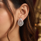 Border Teardrop Rhodium Stud with Layered Floral Layout and Raised Detailing