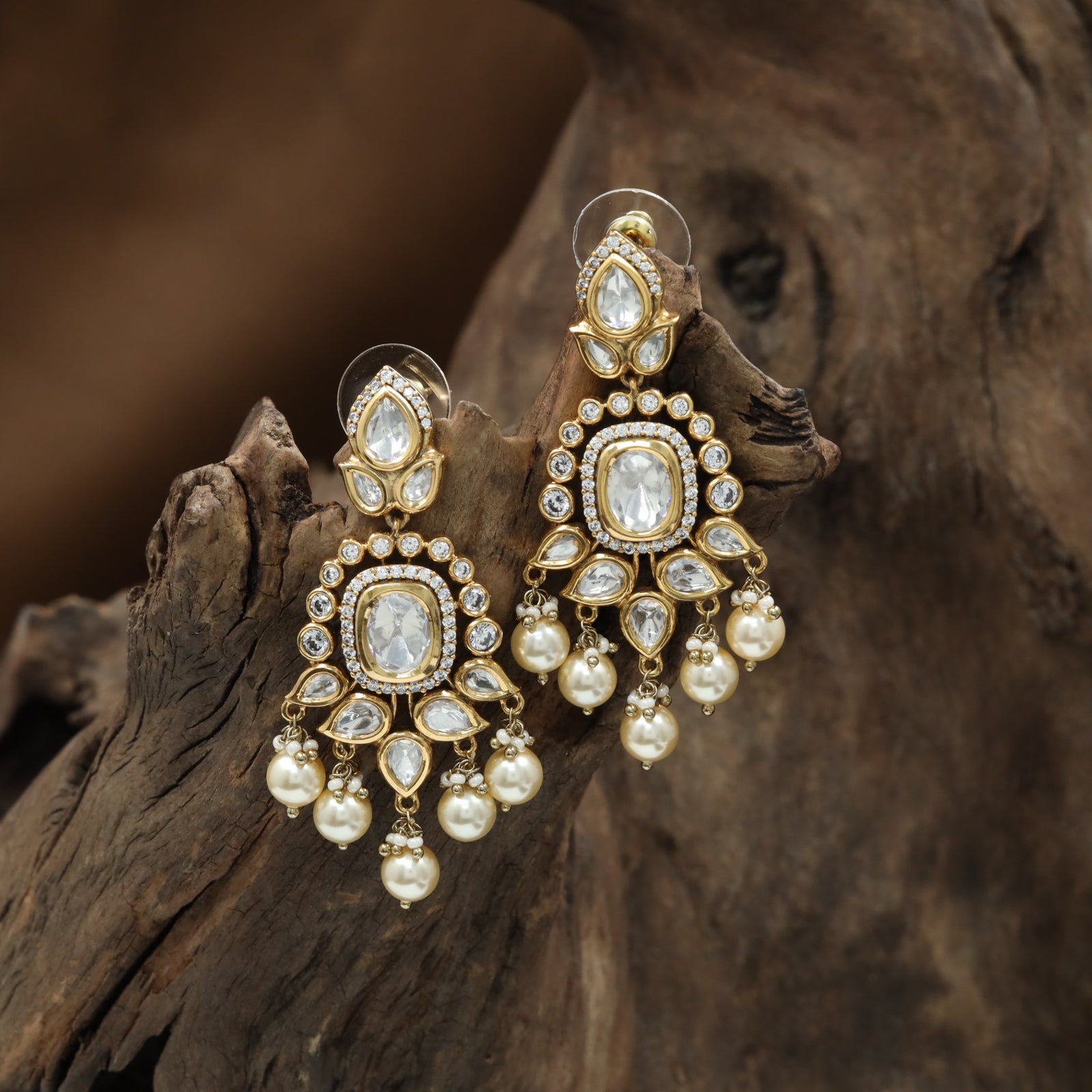 Oval Frame Kundan Hanging with Pearl Tassel Clusters and Border Detailing