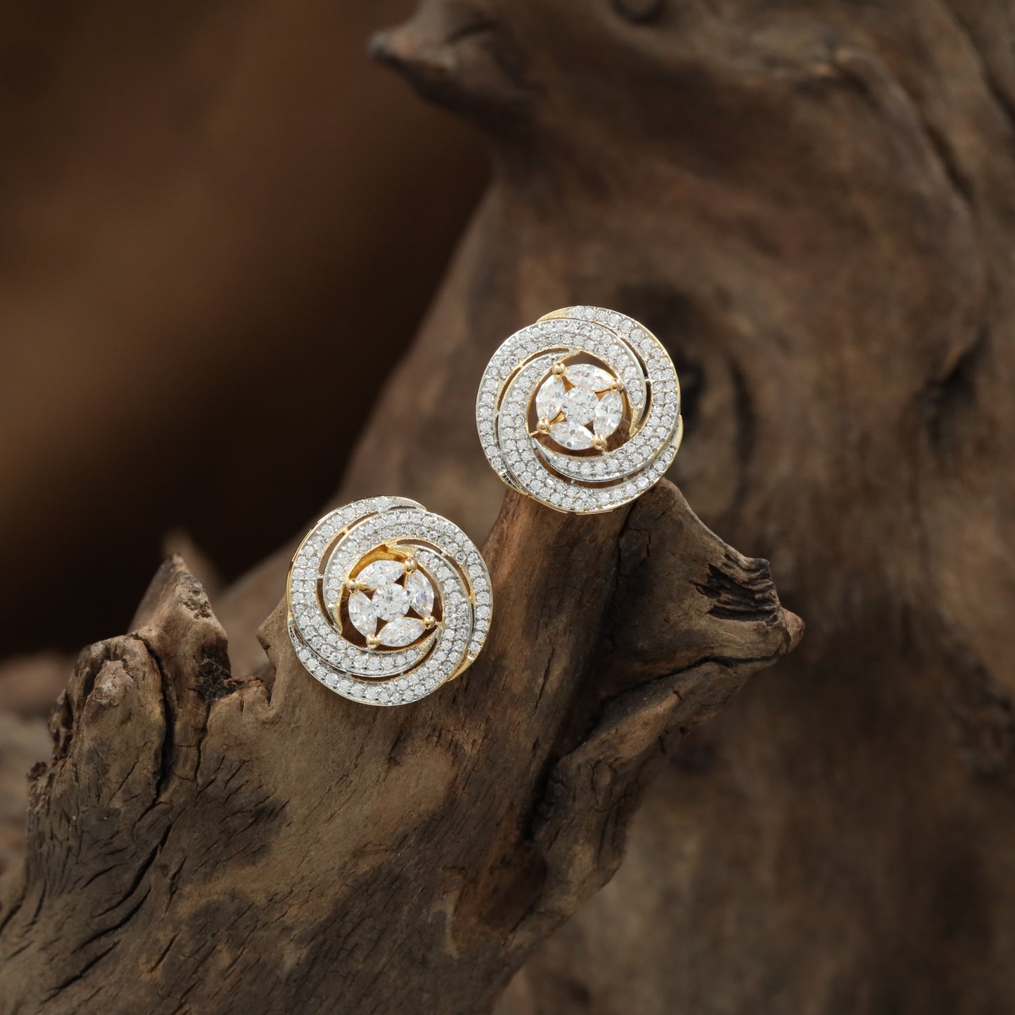 Circular halo GJ stud featuring concentric border detailing with floral center styling.