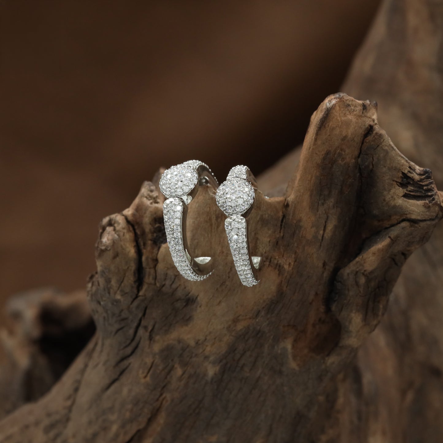 Contemporary Rhodium Stud Featuring a Smooth Oval Form and Sweeping Curve