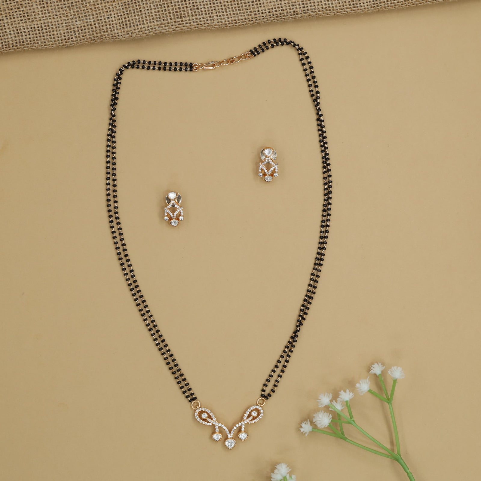 Twisted Loop Gold Polish Mangalsutra with Open Ribbon Pendant