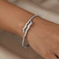 Wave Pattern Kada with Curved Center Arrangement and Border Detailing