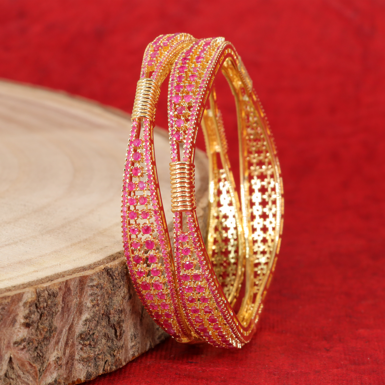 Grand Multi Row Crytalstal Studded Gold Bangles with Decorative Coil Accent