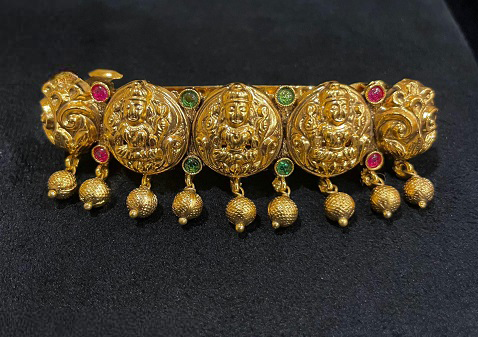 Antique Lakshmi Hair Clip with sculpted goddess panels and traditional hanging drops
