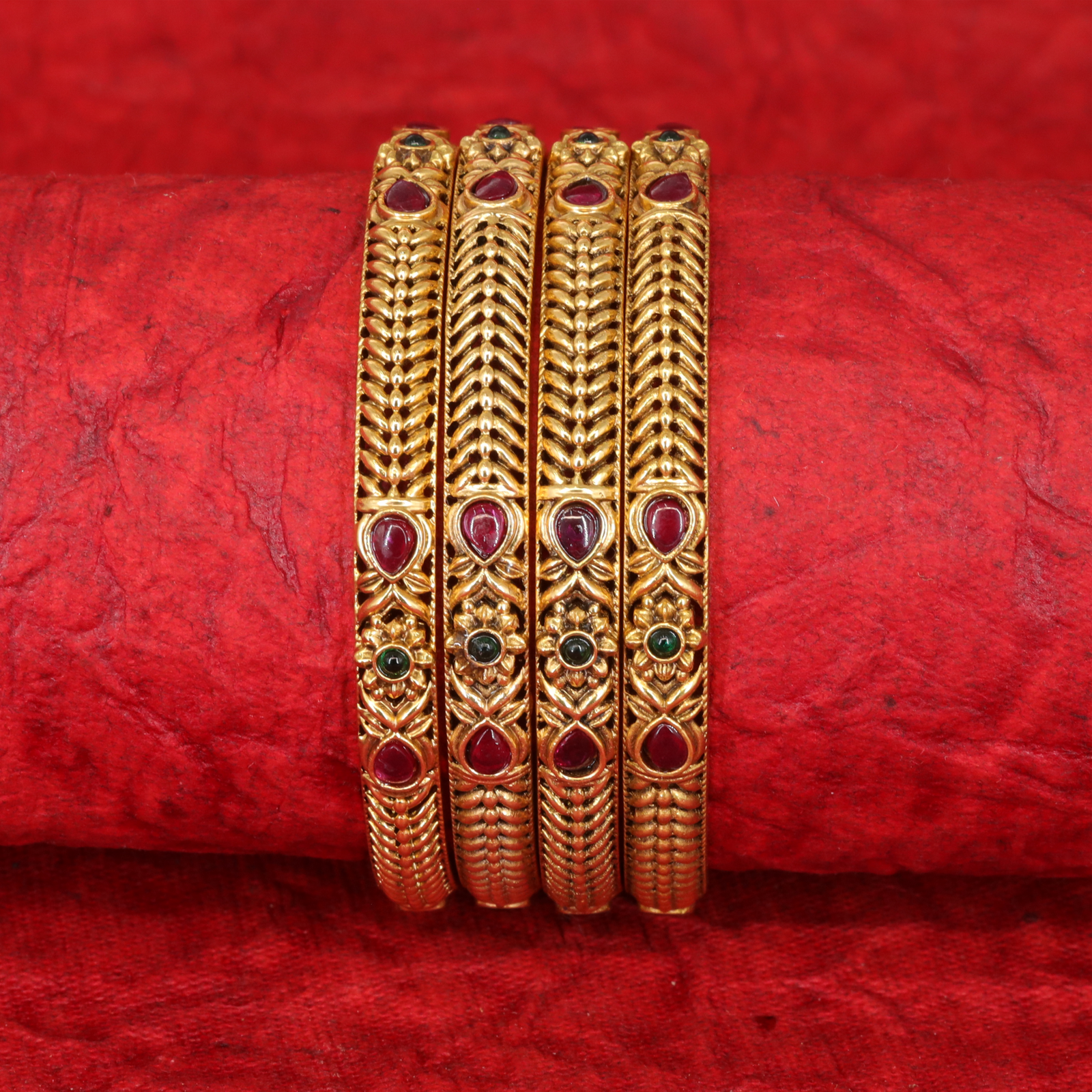 Ratnarekha Sculpted Feather Pattern Bangles with Gem Medallions