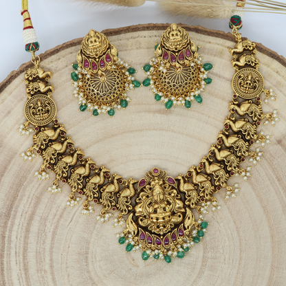 Majestic Lakshmi Idol Necklace with Sculpted Peacock Panel Links