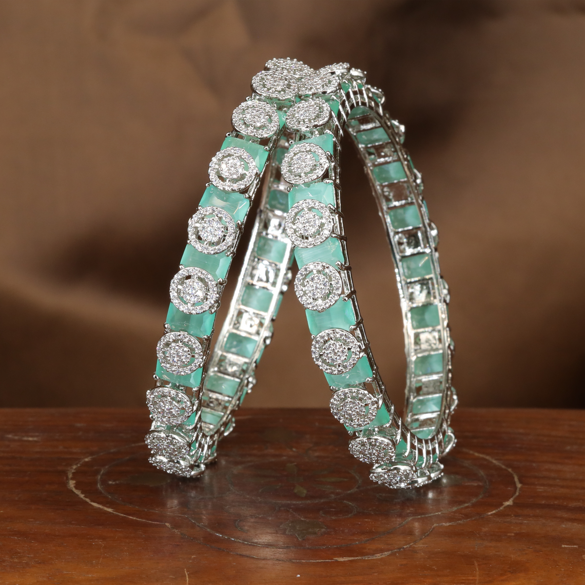 Brilliant Halo Crest Rhodium Bangles with Repeating Circular Disc Panels