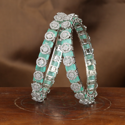 Brilliant Halo Crest Rhodium Bangles with Repeating Circular Disc Panels