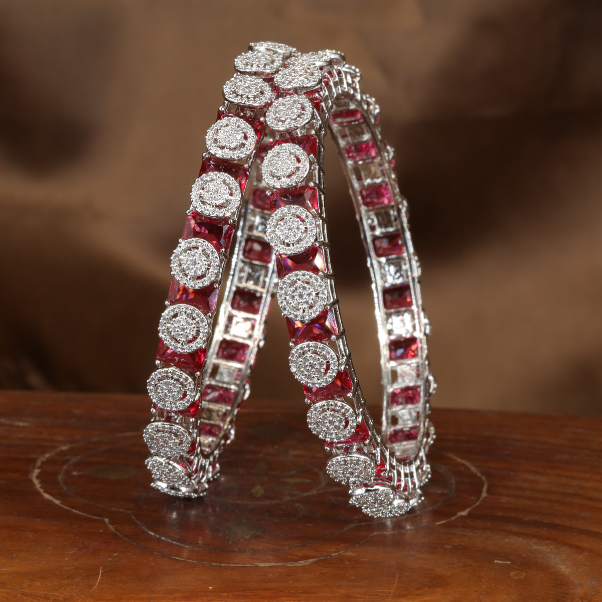 Brilliant Halo Crest Rhodium Bangles with Repeating Circular Disc Panels