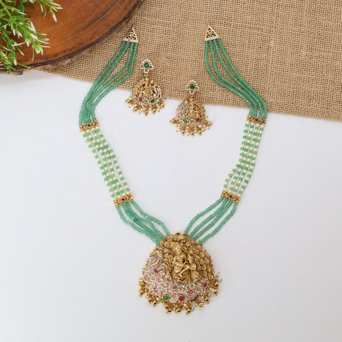 Gokulapriya Multi Strand Green Long Haara with Floral Framed Divine Pendant