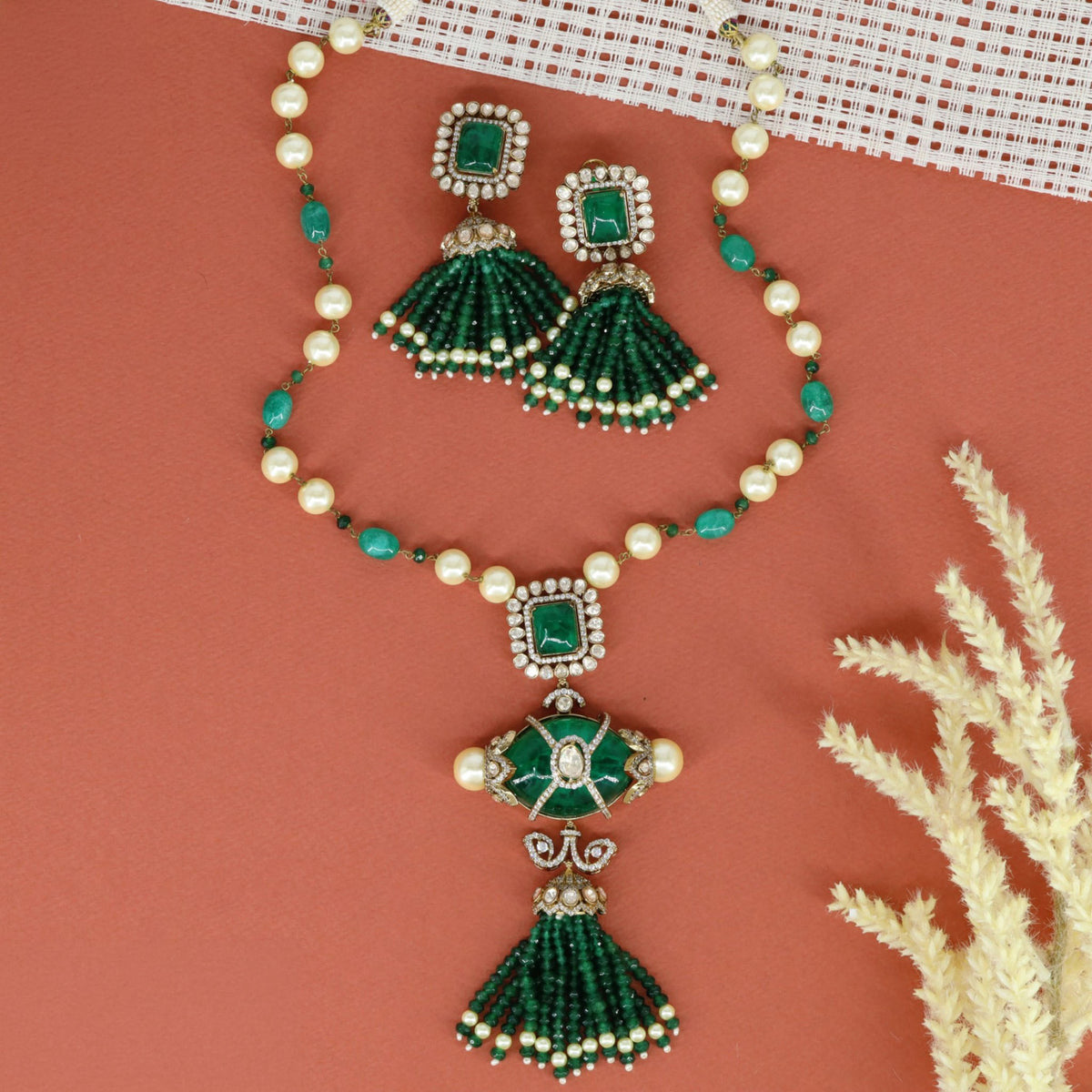 Long haara adorned with rectangular stone settings and ornamental beadwork