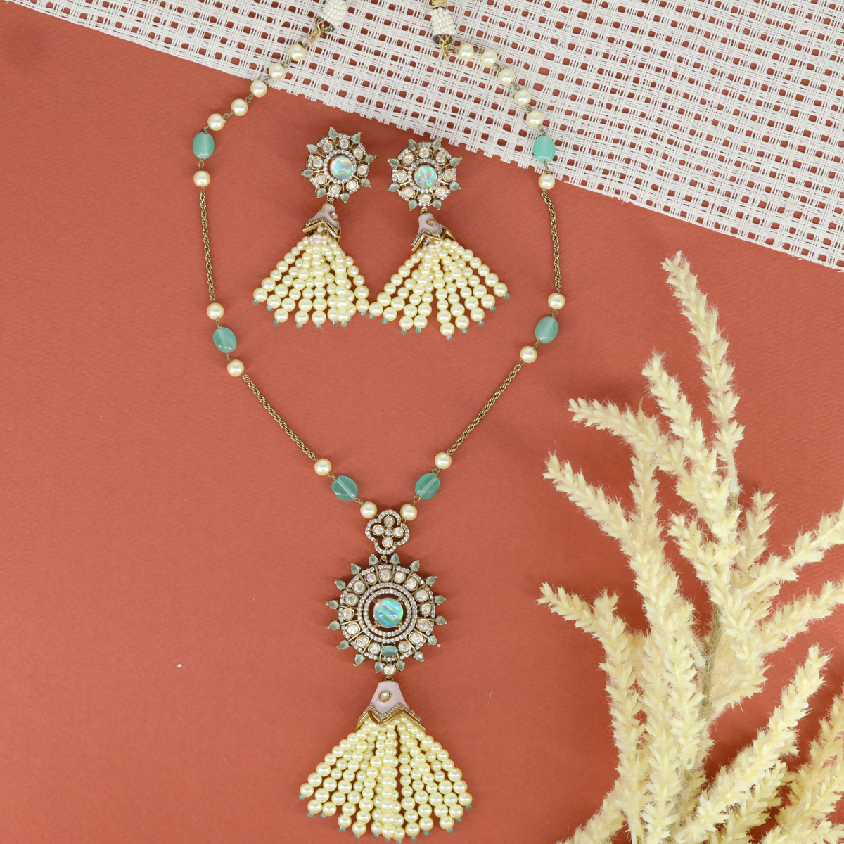 Elegant Beaded Chain Necklace with Sunburst Pendant and Tassel Earrings