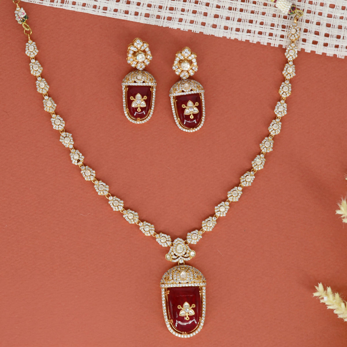Kundan necklace with a framed rectangular pendant and matching earrings