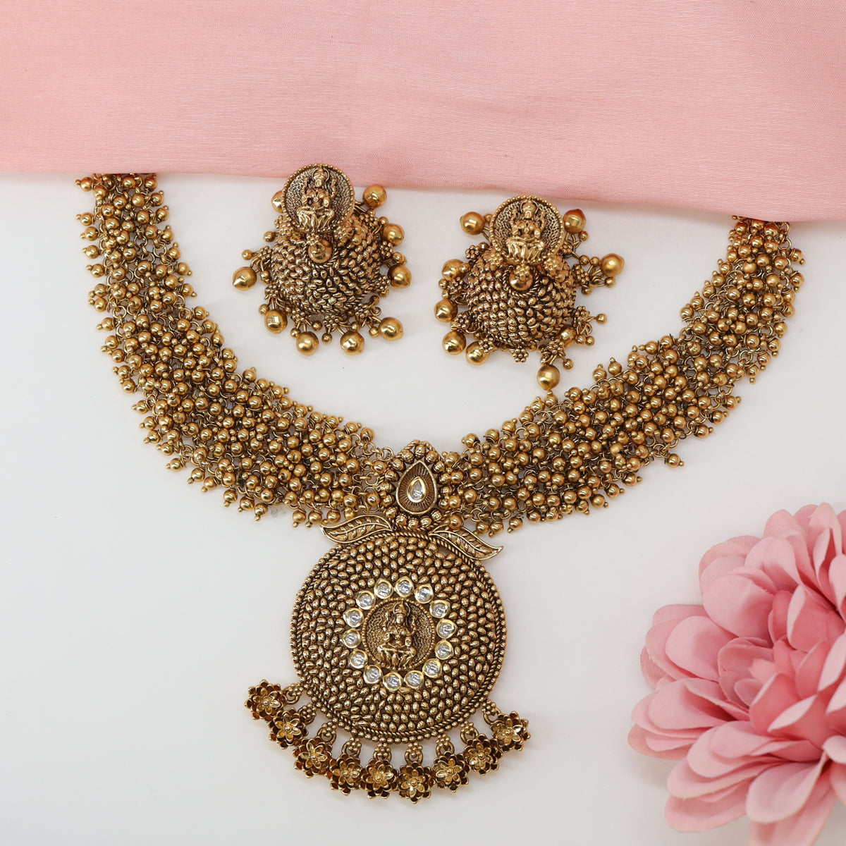 Grand Beaded Collar Necklace with Central Circular Medallion and Sculpted Deity Pendant