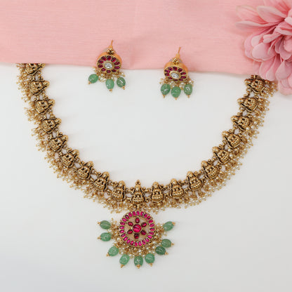 Grand Lakshmi Relief Necklace with Linked Shrine Frames and Circular Gem Pendant