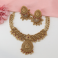 Lakshmi Radiant Disc Antique Necklace with Ornamental Scroll Pattern