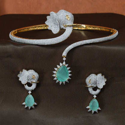 Gold polish necklace featuring an elephant head and curved cuff design
