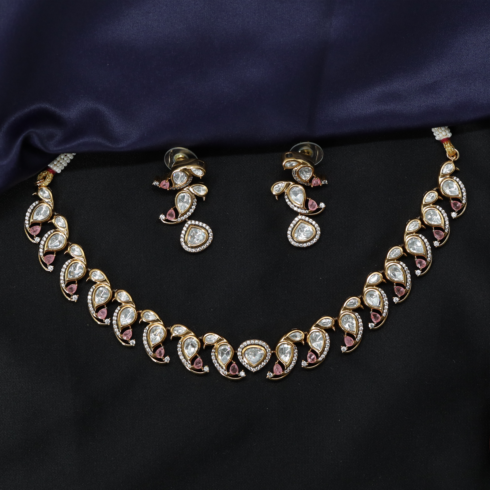 Structured Design Necklace with Repeating Curved Elements and Earrings