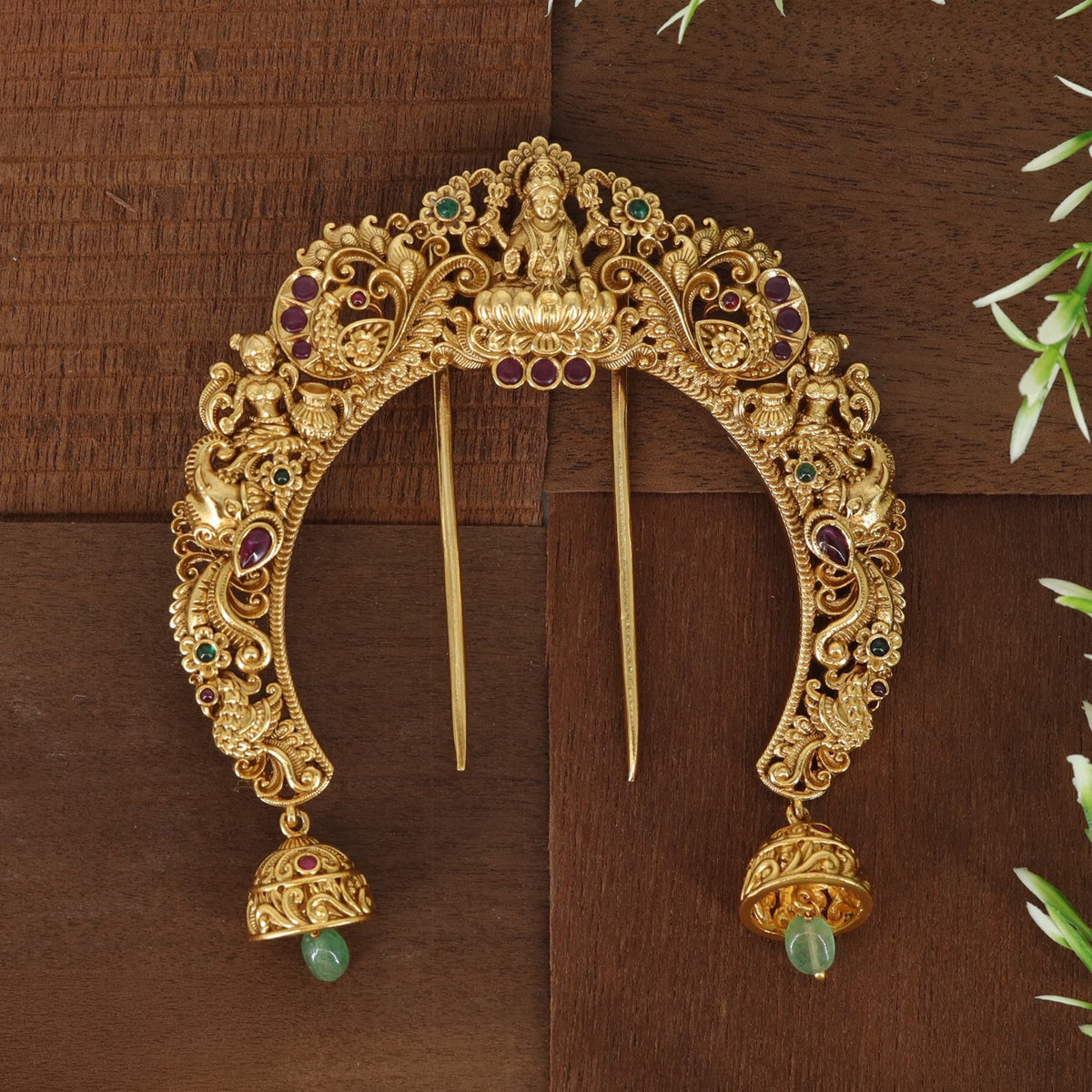 Royal Lakshmi arch with intricate floral patterns and beautifully crafted hanging bells