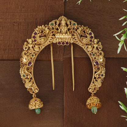 Royal Lakshmi arch with intricate floral patterns and beautifully crafted hanging bells
