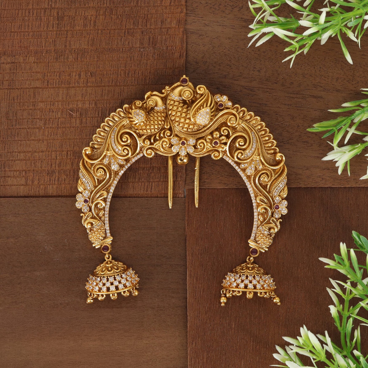 Antique Peacock arch with intricate paisley detailing and elegant hanging bells