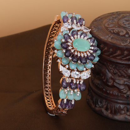 Curving Floral Cluster Bangle with Petal Arrangement and Statement Center