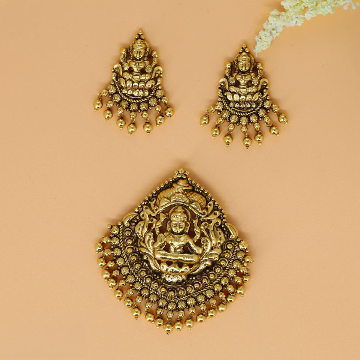 Antique pendant set with Lakshmi centre and finely detailed sculpted work