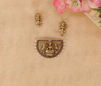 Antique pendant set featuring seated Lakshmi surrounded by elephant detailing