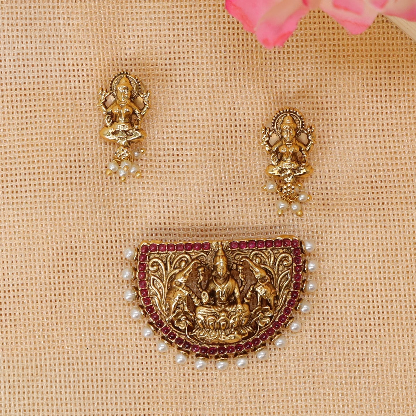 Antique pendant set featuring seated Lakshmi surrounded by elephant detailing
