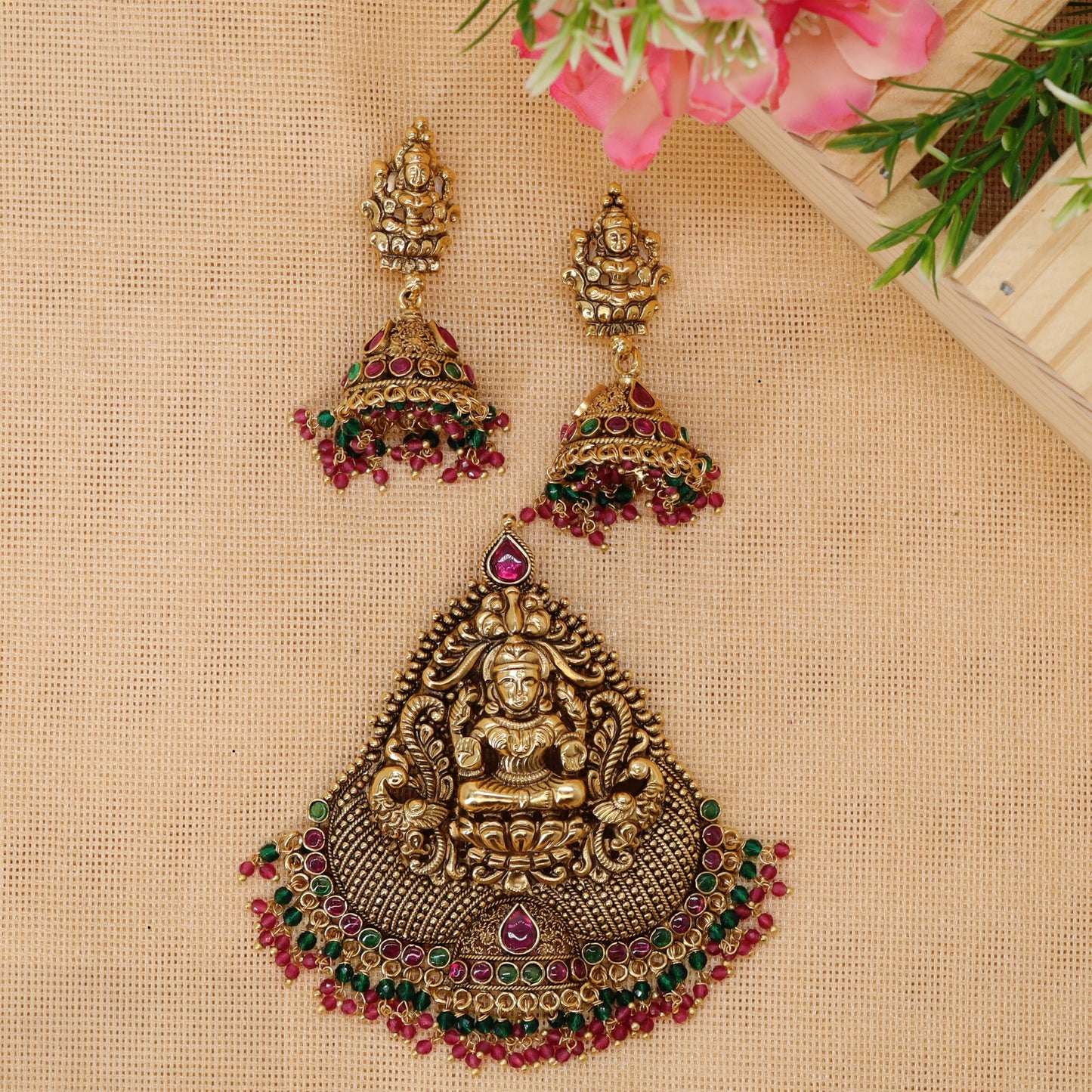 Lakshmi pendant set with ornate goddess detailing and decorative bead fringe