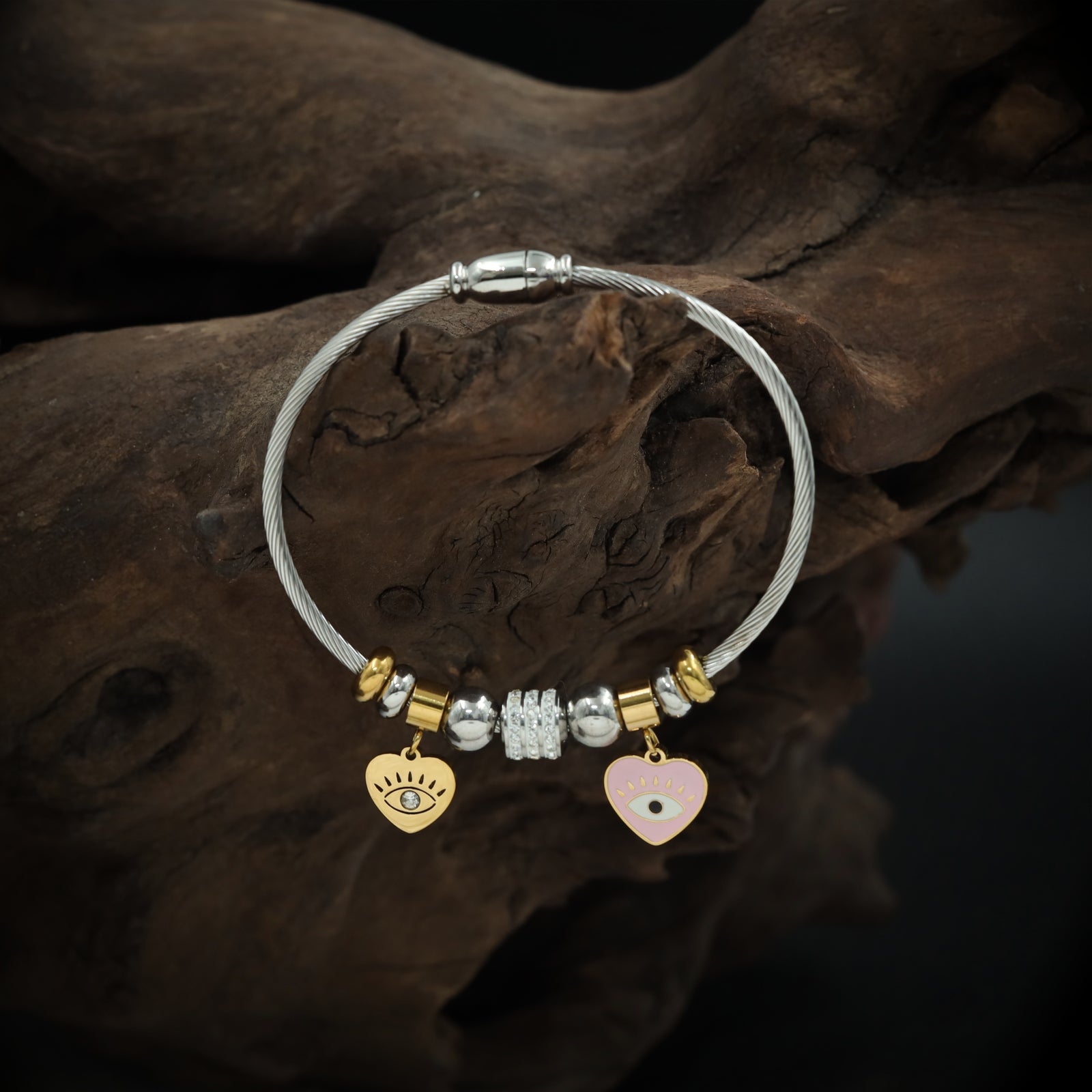 Playful Charm Bracelet with Cable Wire Band and Hanging Heart Eye Pendants