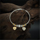 Playful Charm Bracelet with Cable Wire Band and Hanging Heart Eye Pendants
