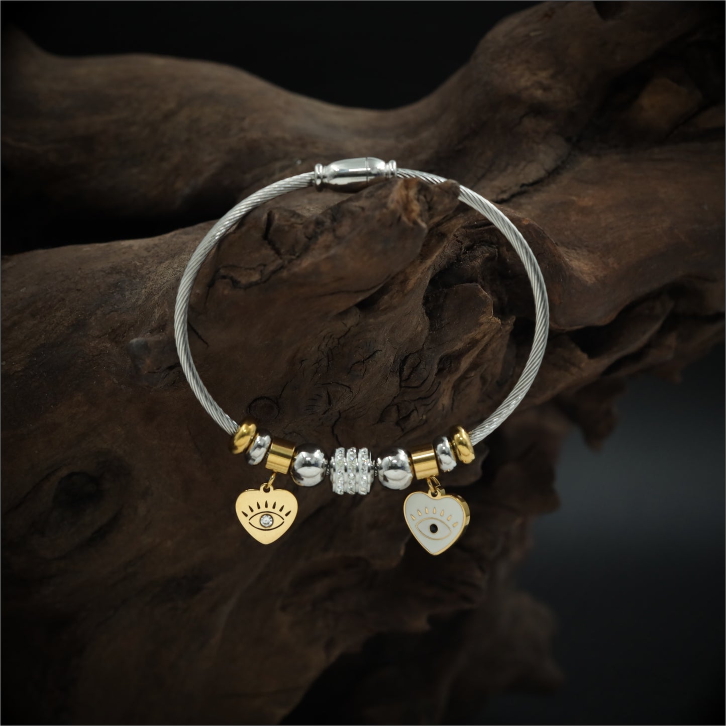 Playful Charm Bracelet with Cable Wire Band and Hanging Heart Eye Pendants