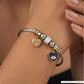 Playful Charm Bracelet with Cable Wire Band and Hanging Heart Eye Pendants