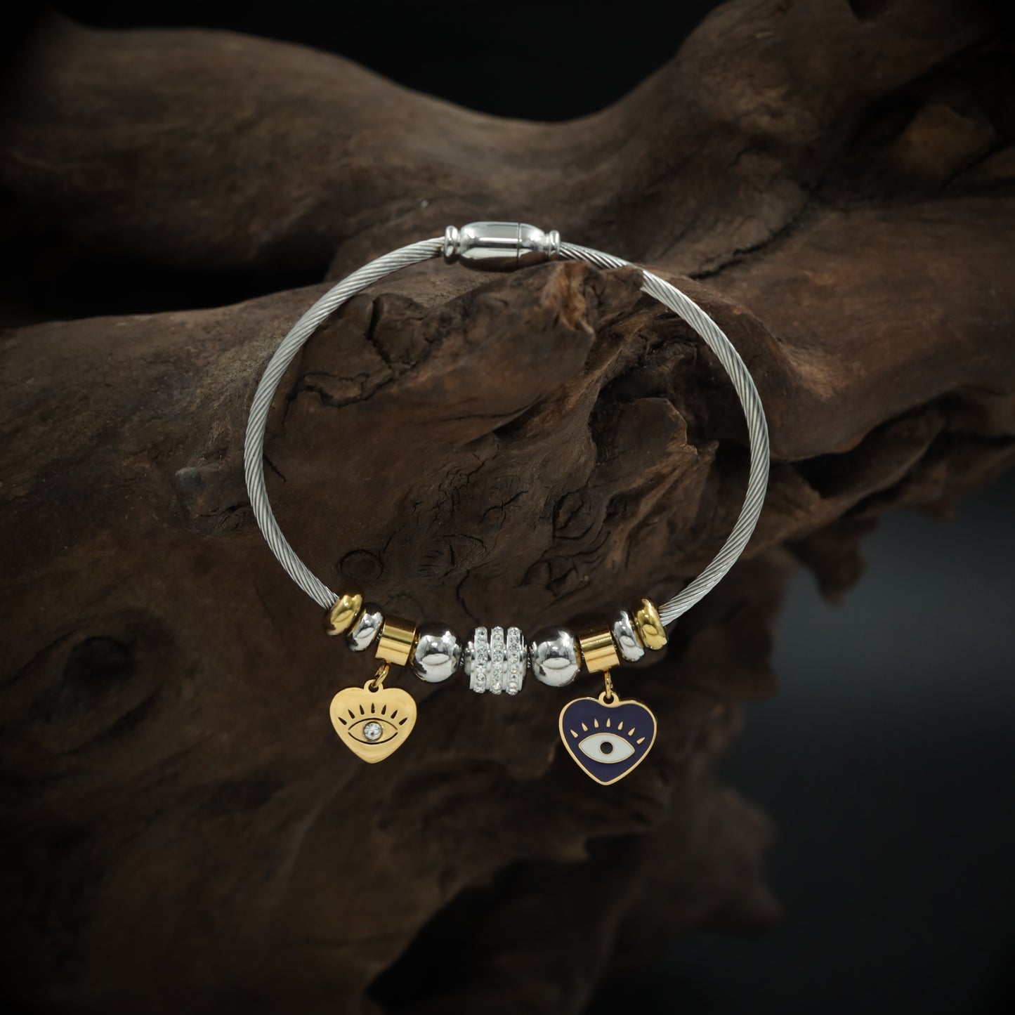 Playful Charm Bracelet with Cable Wire Band and Hanging Heart Eye Pendants