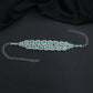 Grand teardrop Rhodium Choker with repeating framed elements and structured openwork