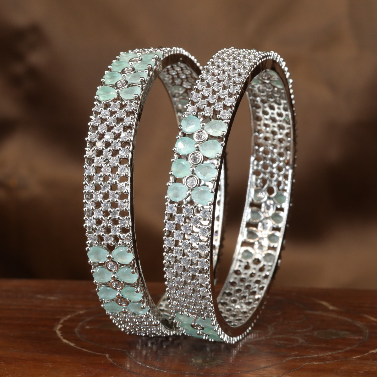 Intricate Mesh Pattern Rhodium Bangles with Clustered Oval Highlights