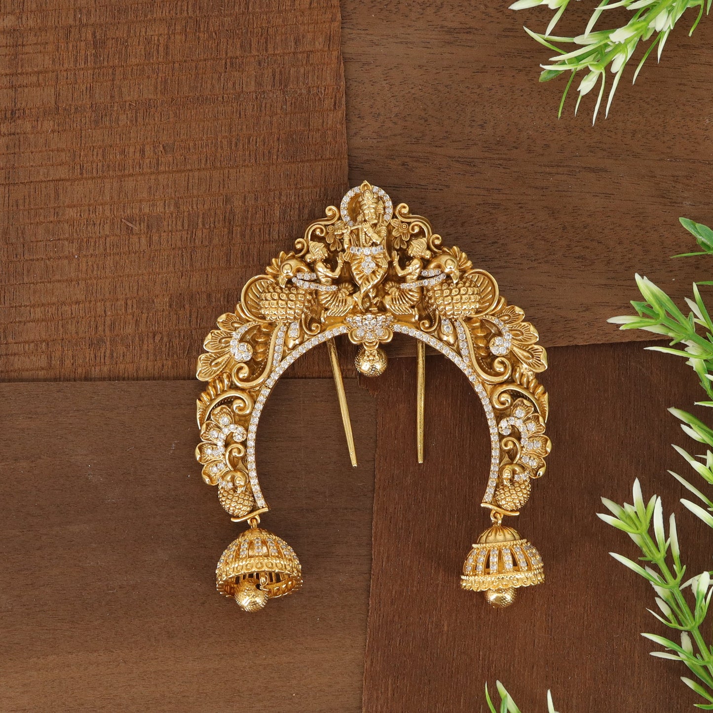 Intricate Curved Hair Ornament with Central Deity Figure and Detailed Side Elements
