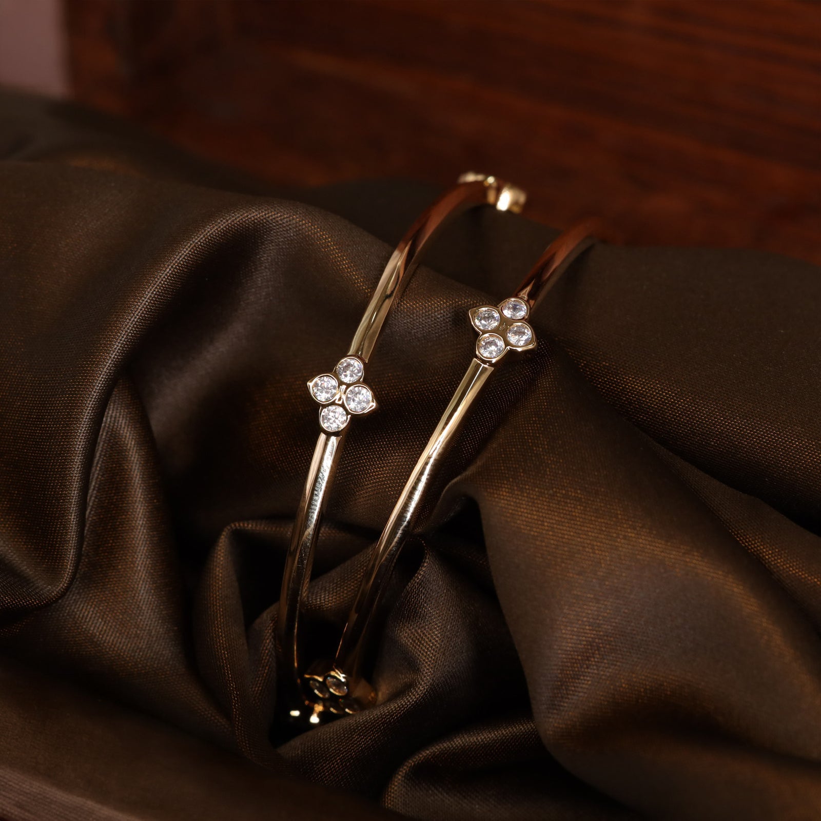 Elegant Slim Bangles with Four Stone Cluster Centerpiece