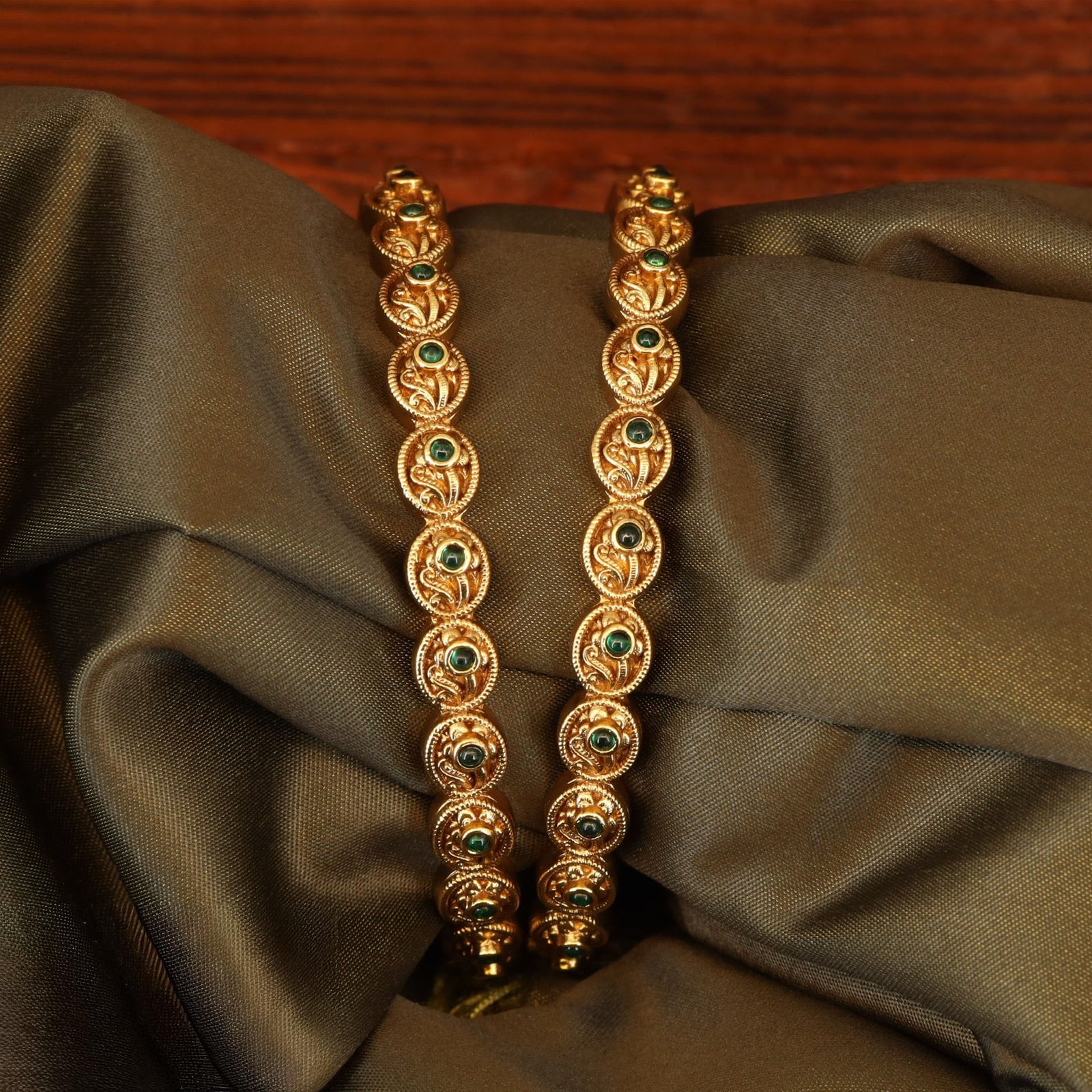 Curved Paisley Design Bangles with Round Panel Links and Textured Borders