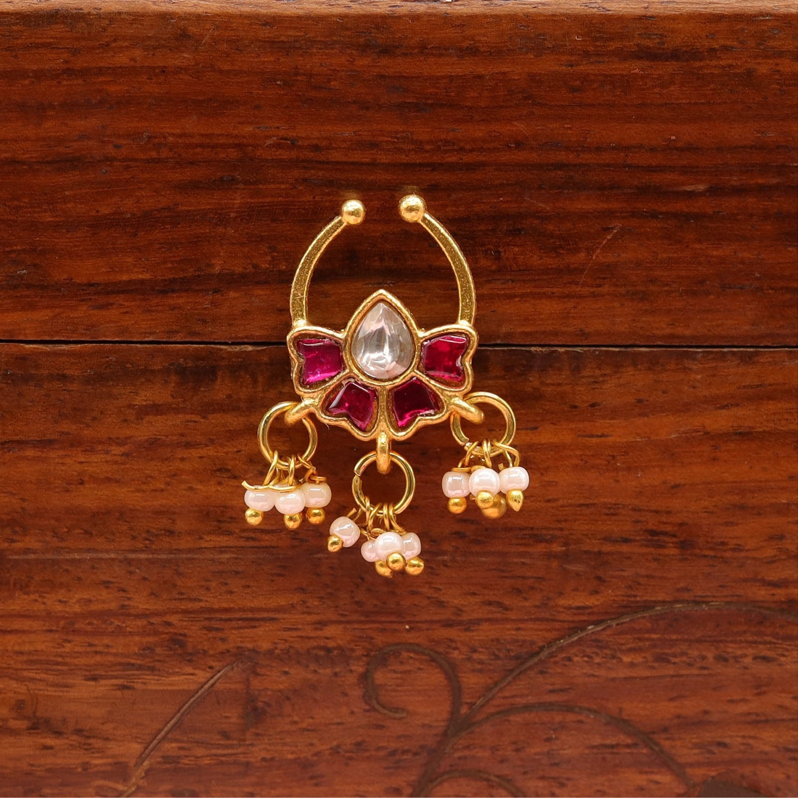 Bloom shaped nose pin with curved hoop and dangling pearl bunch accents