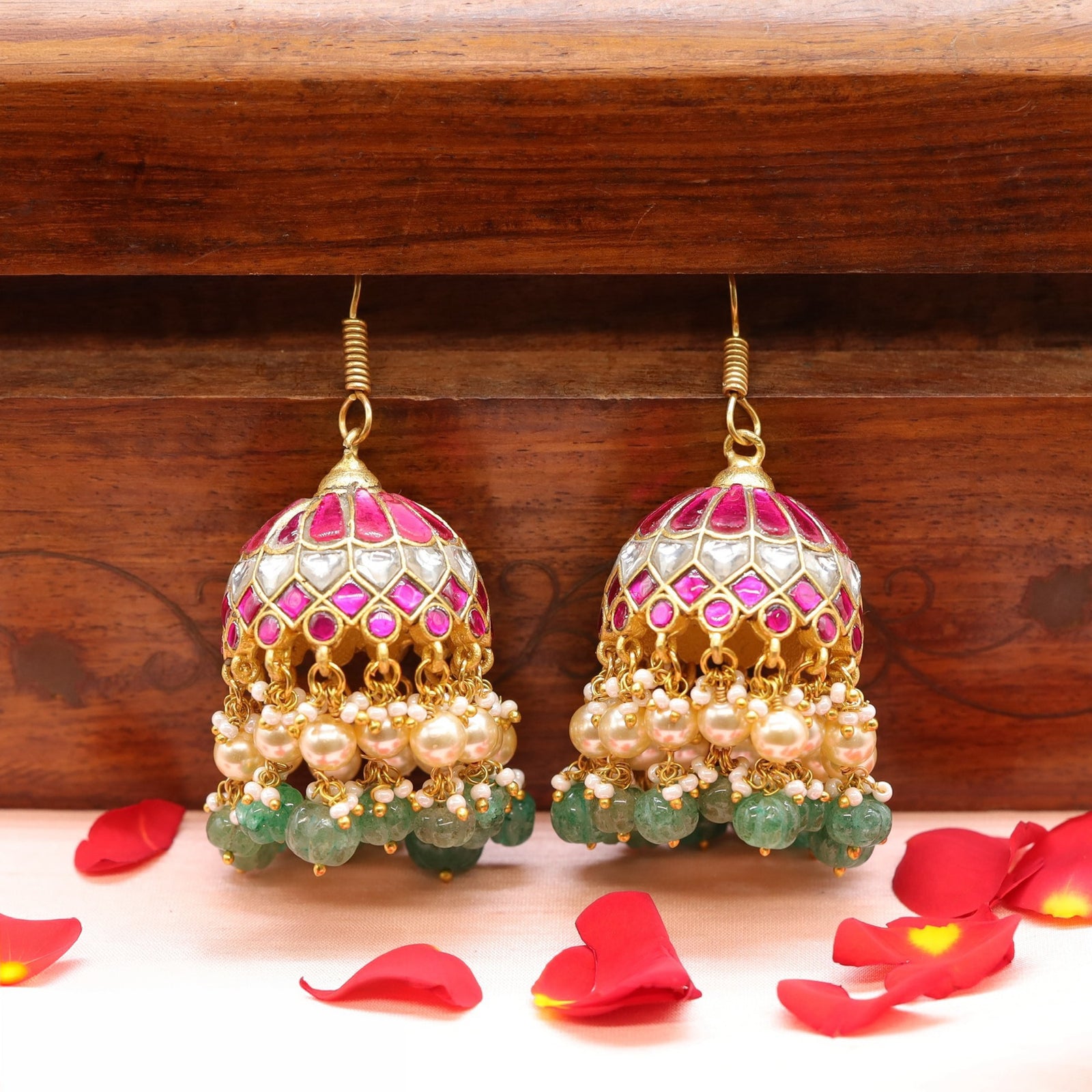 Rounded dome jhumka with structured surface and cascading drop layers