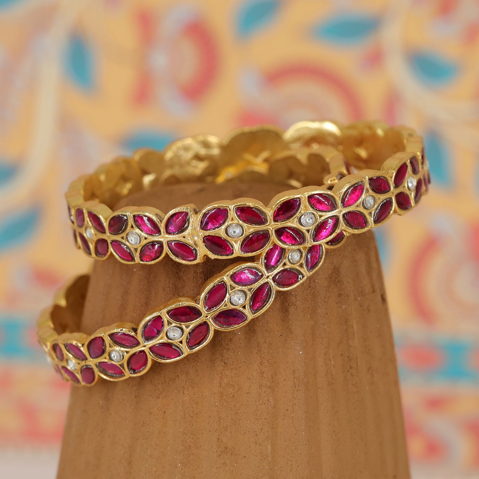 Continuous petal set bangles with clustered oval stone pattern