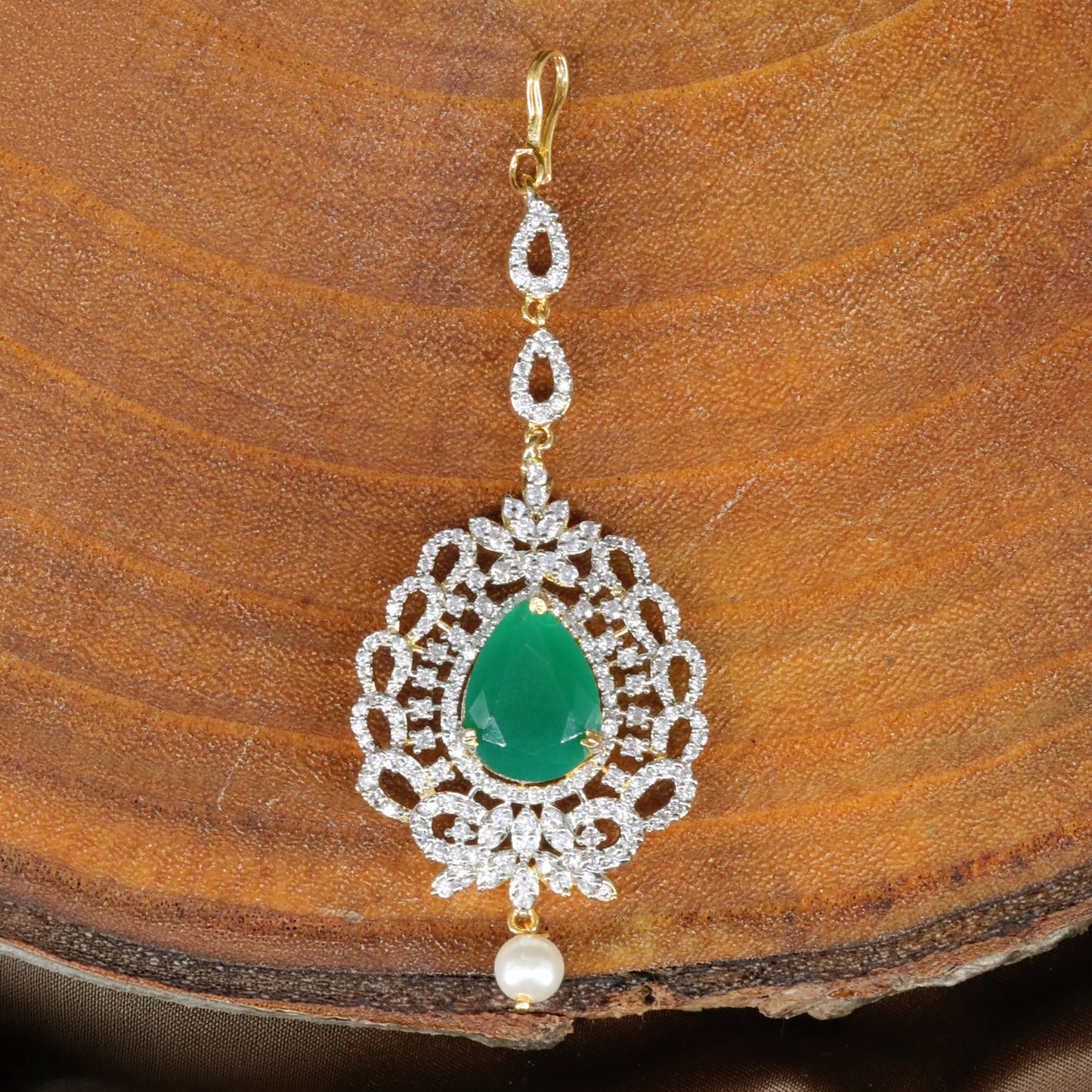 Intricate Frame Tikka with Central Highlight and Decorative Border Work