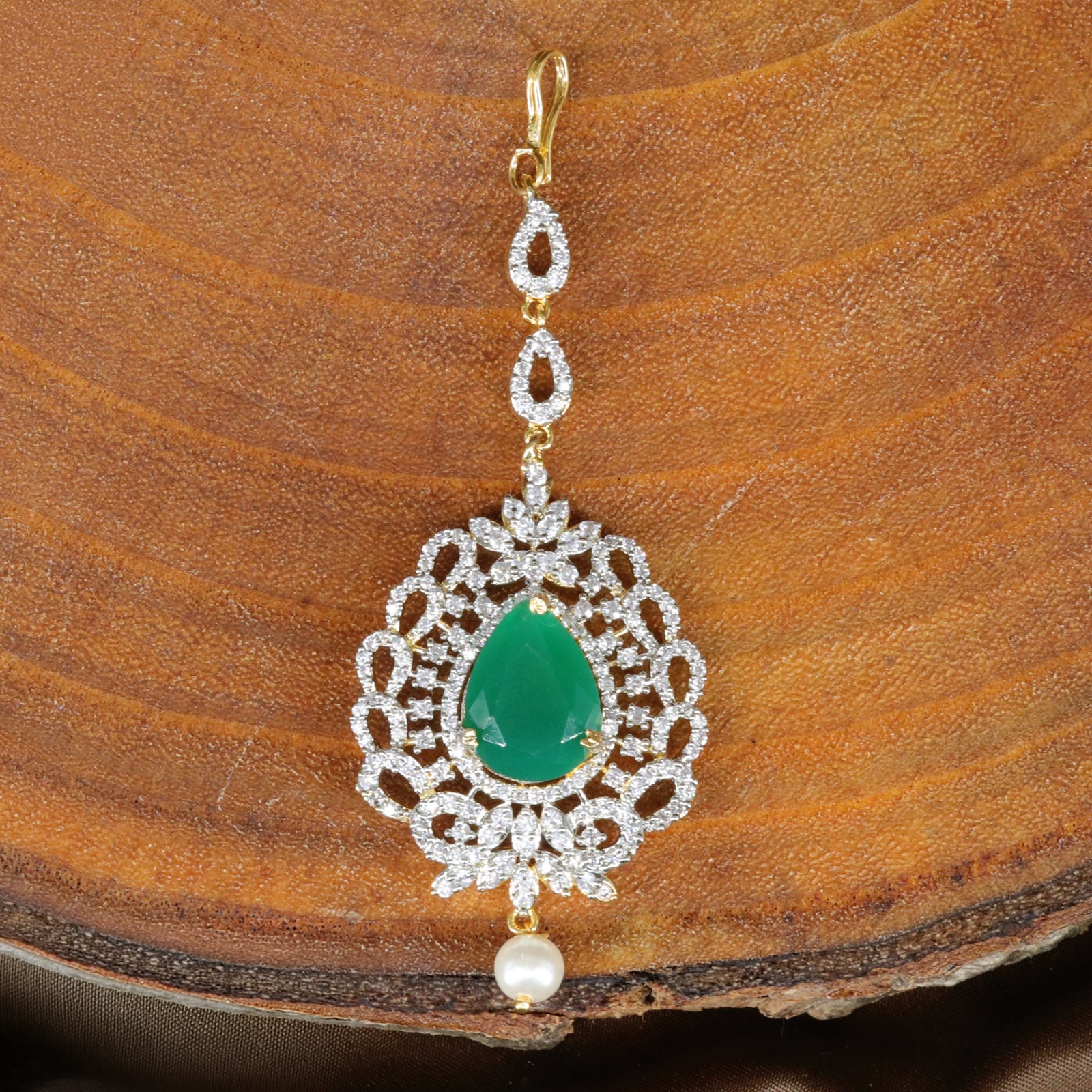 Intricate Frame Tikka with Central Highlight and Decorative Border Work