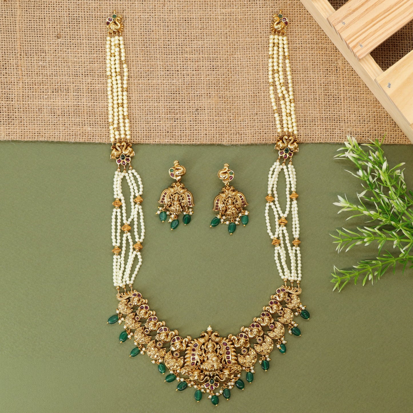 Traditional long haara with Lakshmi centrepiece and repeated ornamental links