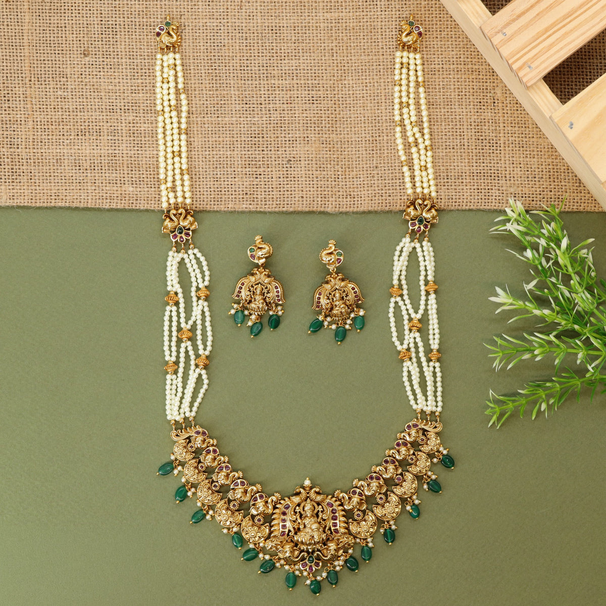 Traditional long haara with Lakshmi centrepiece and repeated ornamental links