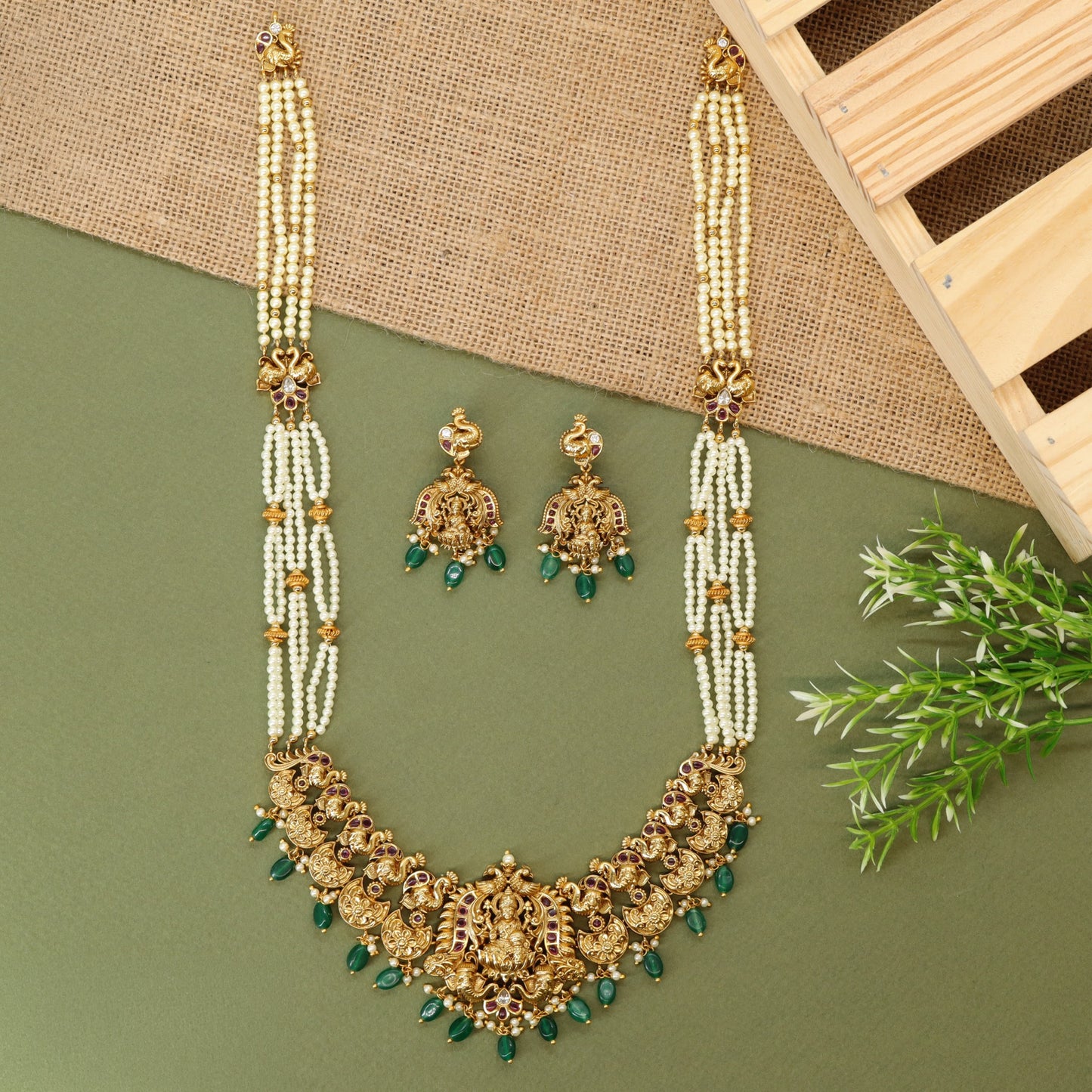 Traditional long haara with Lakshmi centrepiece and repeated ornamental links