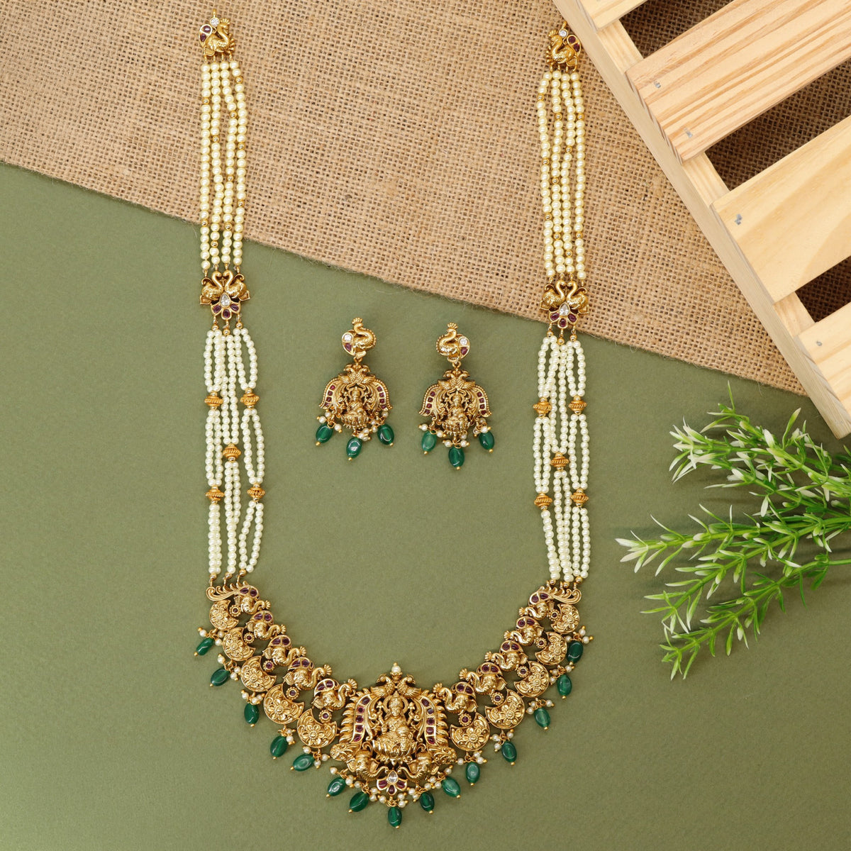 Traditional long haara with Lakshmi centrepiece and repeated ornamental links