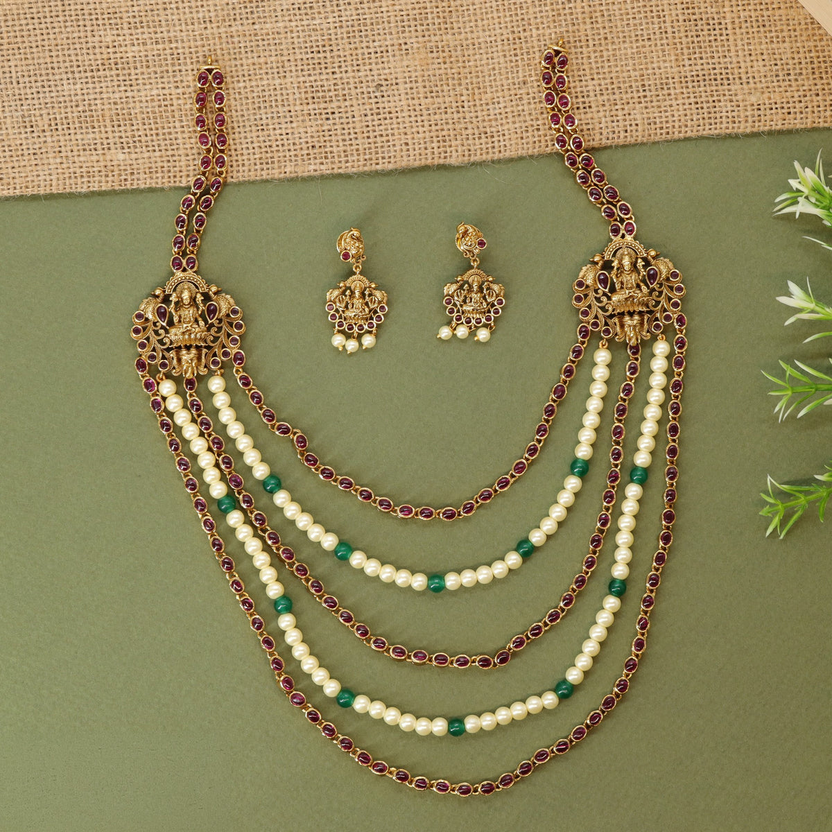 Antique long haara featuring framed goddess Lakshmi elements and graduated pearl strands
